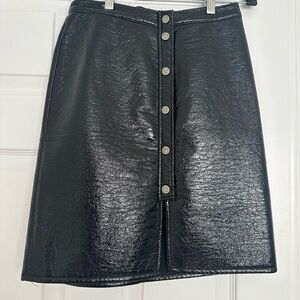 Sleek Black Faux Leather Mini Skirt, size x small.